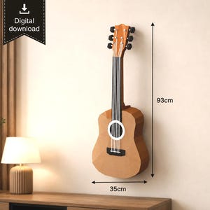 May include: A low-poly brown papercraft guitar wall art piece with a digital download icon. The guitar features a light brown body, a dark brown fretboard with white lines, and a black bridge. Dimensions are clearly marked as 93cm by 35cm.