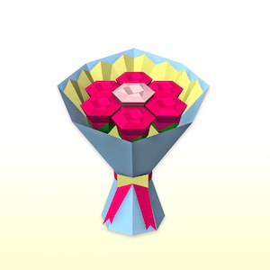 May include: A bouquet of pink paper flowers wrapped in blue and yellow paper with a pink ribbon.