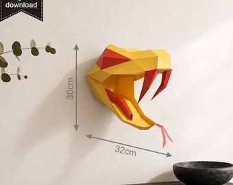 May include: A low-poly geometric snake head wall sculpture in yellow and red with a protruding tongue and fangs. The design features a digital download label and dimension markers indicating a height of 30cm and a width of 32cm on the wall.