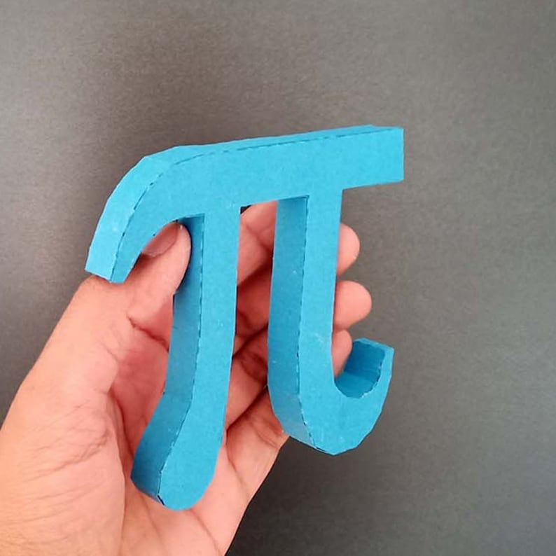 May include: A blue papercraft model of the mathematical symbol pi.