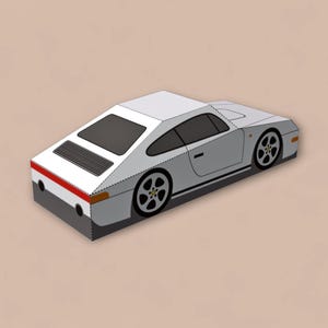 May include: A white sports car illustration with black wheels and a black rear window. The car has a red stripe on the back and is set against a beige background. The car's design is geometric and stylized.