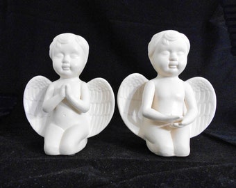 White Porcelain Cherub Sculptures – 2pc. Set