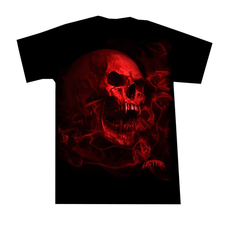 May include: Black t-shirt with a red skull graphic surrounded by red flames. The skull has a menacing expression with sharp teeth and a large, open mouth.