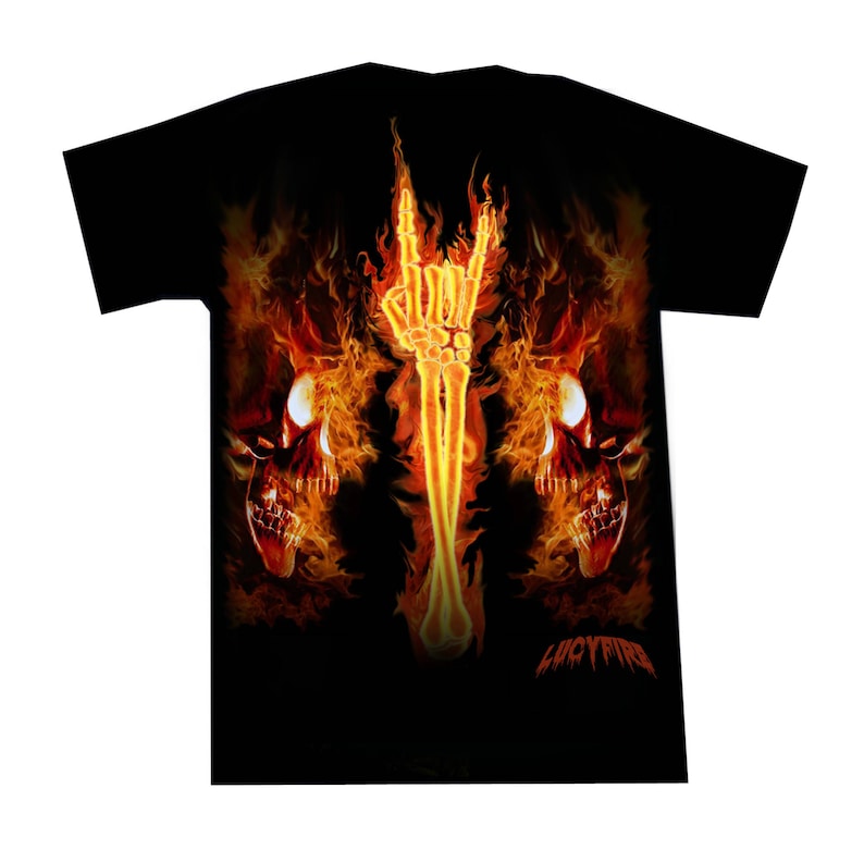 May include: Black t-shirt with a fiery design featuring two skulls and a skeletal hand making the rock and roll hand gesture. The text "LUCYFIRE" is printed on the bottom of the shirt.