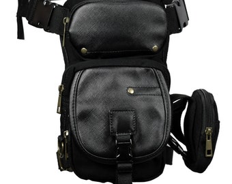 May include: Black canvas leg bag with multiple pockets and a zippered pouch. The bag has a wide adjustable belt and multiple zipper closures.