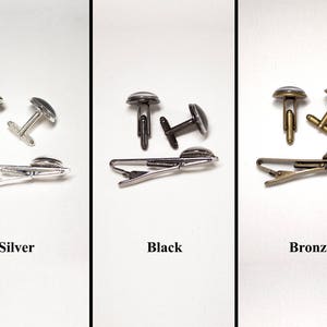 May include: Three sets of cufflinks and tie clips in silver, black, and bronze. Each set includes a pair of cufflinks and a tie clip. The cufflinks and tie clips have a circular design with a dark center. The word "Silver", "Black", and "Bronze" are below each set.