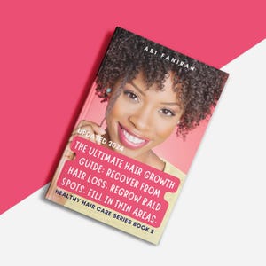May include: A pink book cover with a woman's face and the title "The Ultimate Hair Growth Guide: Recover from Hair Loss. Regrow Bald Spots. Fill in Thin Areas."  The book is part of the "Healthy Hair Care Series Book 2".