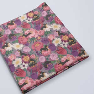 May include: A gray and purple fabric with a repeating pattern of black dachshund dogs and pink, white, and purple flowers.