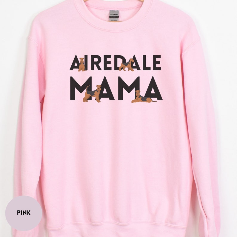 May include: Pink sweatshirt with the text "Airedale Mama" in black letters. The text is surrounded by small illustrations of Airedale Terriers.