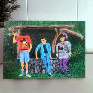 May include: A painting of three people standing in front of a stone well. The person on the left is wearing a red shirt with a Mickey Mouse design, blue shorts, and white sneakers. The person in the middle is wearing a blue jacket, blue jeans, and white sneakers. The person on the right is wearing a gray sweater with a pink bear design and the text "Class of '84", purple leggings, and purple shoes.