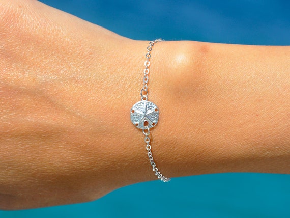 Silver sand dollar bracelet best sale