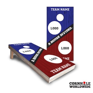 May include: Two rectangular cornhole boards featuring a split design with blue and red wood-grain patterns. A diagonal black stripe displays the text A HOUSE DIVIDED. Each board includes two circular cutouts, placeholders for logos, and the text TEAM NAME.