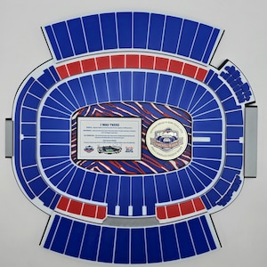 May include: A stadium-shaped wall art piece with blue and red seating sections. The center features a framed text that reads "I WAS THERE" and a circular emblem with the text "FAREWELL SEASON". The artwork is a tribute to a sports team.