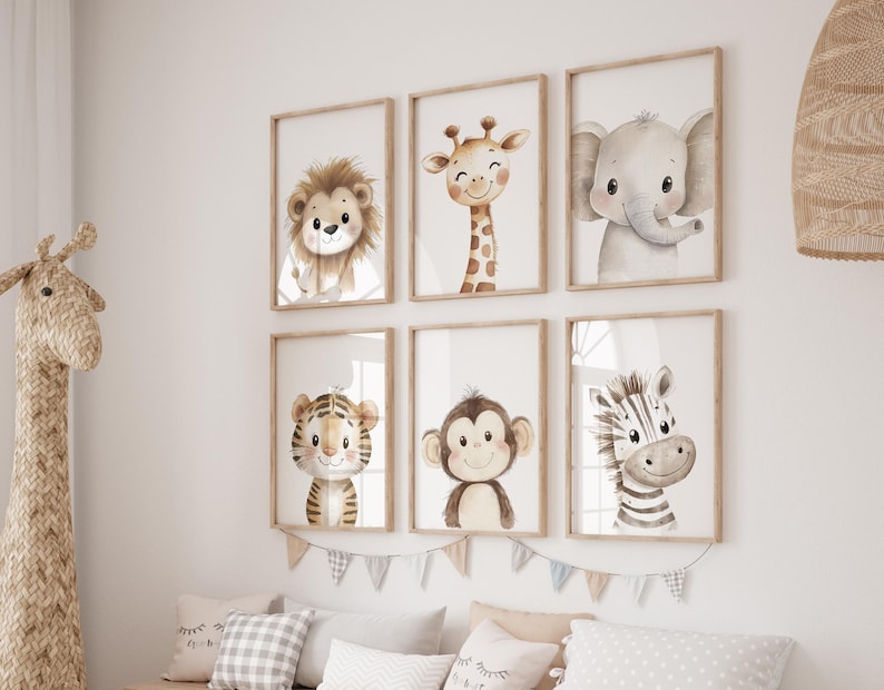 May include: Set of six watercolour animal prints featuring a lion, giraffe, elephant, tiger, monkey and zebra. Each print has a white background and is framed in a light wood frame.