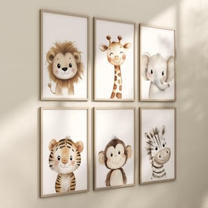 May include: Six framed prints featuring watercolour illustrations of various animals, including a lion, giraffe, elephant, tiger, monkey, and zebra. Each print has a white background and is framed in a light brown wood frame.