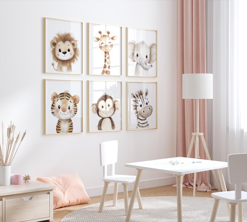 May include: A set of six framed animal prints featuring a lion, giraffe, elephant, tiger, monkey, and zebra. The prints are in a watercolour style and have a light brown background. The frames are gold and the prints are hung on a white wall.