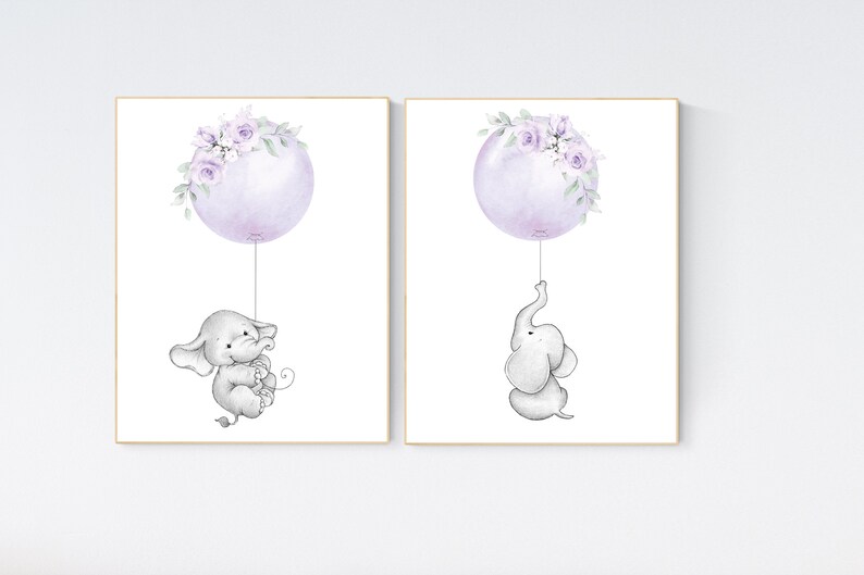 May include: Two printable nursery art prints featuring a cute gray elephant holding onto a purple balloon with lavender floral accents.