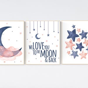 May include: Three watercolor prints with a navy blue crescent moon, pink clouds, and stars. The middle print says "We love you to the moon & back".