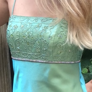 Party dress, formal dress, satin sage green dress,size 6, green dress has an embellished top with lacing up the back.
