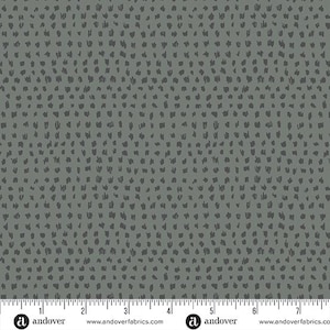 May include: A gray fabric with a repeating pattern of small, dark gray, hand-drawn shapes. The fabric is shown with a ruler measuring 7 inches.