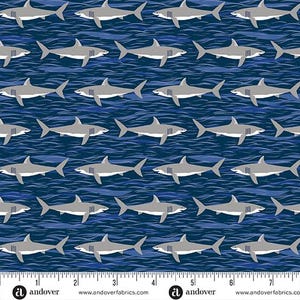 May include: A repeating pattern of gray sharks swimming on a dark blue background with wavy lines. The sharks are facing different directions, creating a dynamic and engaging design. This fabric is suitable for various sewing projects.