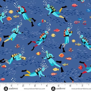 May include: A blue fabric pattern featuring divers in light blue suits with orange and black tanks, swimming among colorful fish. White bubbles and small fish silhouettes fill the background. The fabric has a ruler at the bottom with the Andover Fabrics logo.