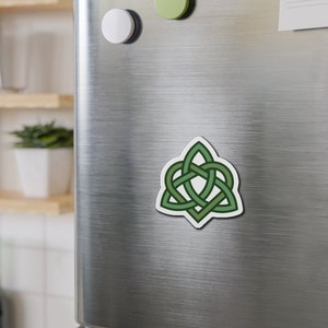 May include: A green Celtic knot design in the shape of a triangle. The knot is made of three intertwined ropes.