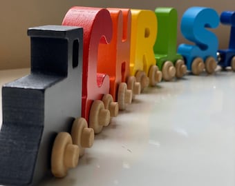 Build your own Train with bright colorful letters. Personalized Wooden Magnetic Alphabet Letters. Engine and Wagon Included.