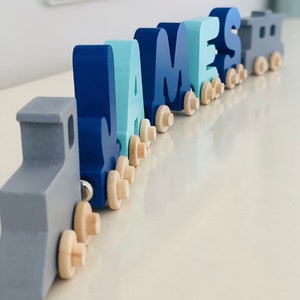 Build your own Train in Mint and Navy letters. Personalized Wooden Magnetic Alphabet Letters. Engine and Wagon Included. Name puzzle.