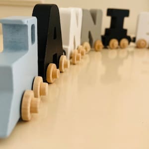 Build your own Train in our Smokey cloud letters. Personalized Wooden Magnetic Alphabet Letters. Baby blue Engine and Wagon Included.