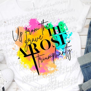 May include: A white sublimation transfer design with a watercolor background in shades of pink, yellow, blue, and green. The text "Up from the grave HE AROSE triumphantly" is in black lettering.