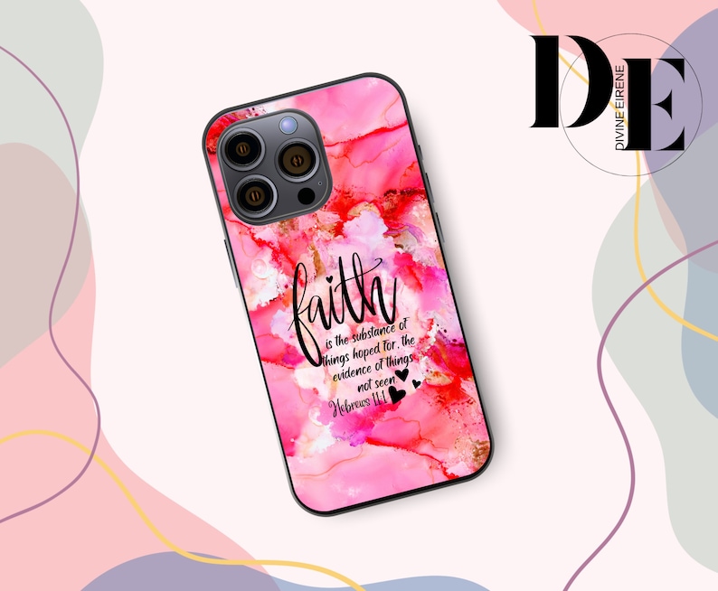 May include: A pink and red phone case with a watercolor design and the quote "faith is the substance of things hoped for, the evidence of things not seen Hebrews 11:1" in black lettering. The case has a black border and a camera cutout.
