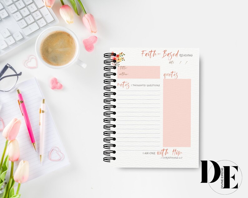 May include: A pink and white journal with a floral design on the cover. The journal is titled "Faith-Based Reading" and has sections for notes, thoughts, questions, and quotes. The journal also includes the scripture "I am one with Him - 1 Corinthians 6:17".