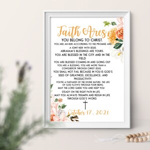 May include: A white framed print with a floral design and the text "Faith Ares You Belong to Christ." The text continues with a list of blessings and a date of October 17, 2021.