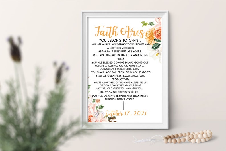 May include: A white framed print with a floral design and the text "Faith Ares You Belong to Christ." The text continues with a list of blessings and a date of October 17, 2021.