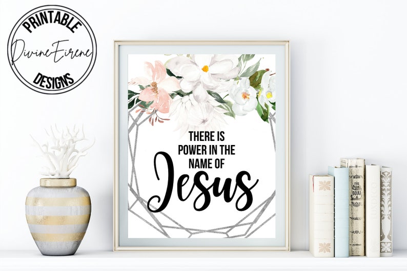 May include: Printable wall art with a floral design and the text "There is power in the name of Jesus".