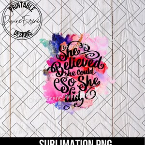 May include: A sublimation design featuring a watercolour background in shades of pink, purple, and blue. The text "She Believed She Could So She Did" is written in black cursive font.