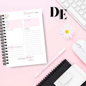 May include: A pink and white notebook with a floral design on the cover. The notebook has a spiral binding and is open to a page with the title "Sermon Note". The page has sections for "Date", "Key Verses", "Title", "Speaker", "Topic", "Key Points", "Notes", and "Prayer". The bottom of the page has the text "I have been chosen - John 15:16".