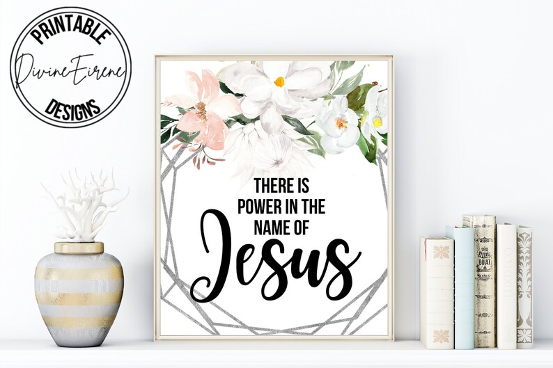 May include: Printable wall art with a floral design and the text "There is power in the name of Jesus".