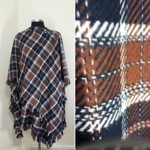 this lambswool cape  an investment piece that you'll cherish for years to come.