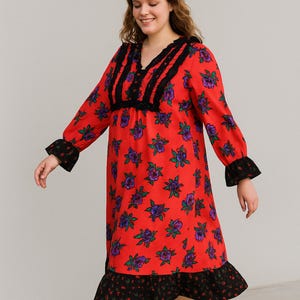 The dress is a very bold and nostalgic piece for the autumn and winter months with its striking color and distinct floral patterns.