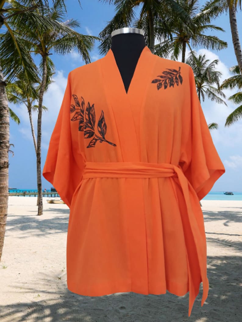 This handpainted statement piece that will turn heads. A beautiful crinkle cotton fabric that will beautifully wrap around you.