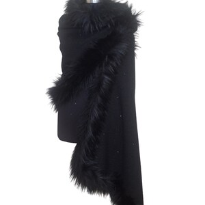 Black heavy tweed evening wrap with luxurious  fur collar, styled in an asymmetrical drape for a dramatic and sophisticated winter look