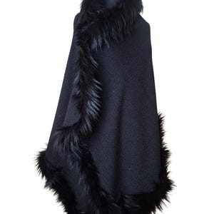 “Side view of the elegant black tweed shawl with fluffy  fur border, revealing the textured heavy fabric and refined winter glamour.”