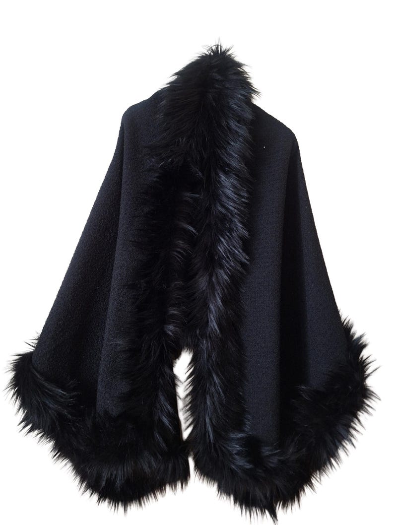 Front view of an elegant heavy black wool tweed shawl with Racoon fur trim and subtle sparkling sequins, handmade winter wrap in luxurious evening style