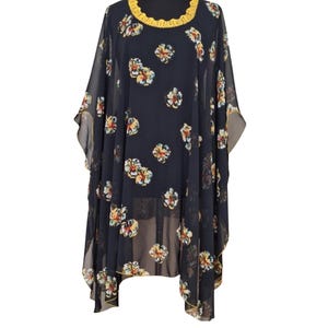 This Timeless elegant handmade kaftan dress featuring floral print, fairy edging hem and beautiful handmade lace oya collar.