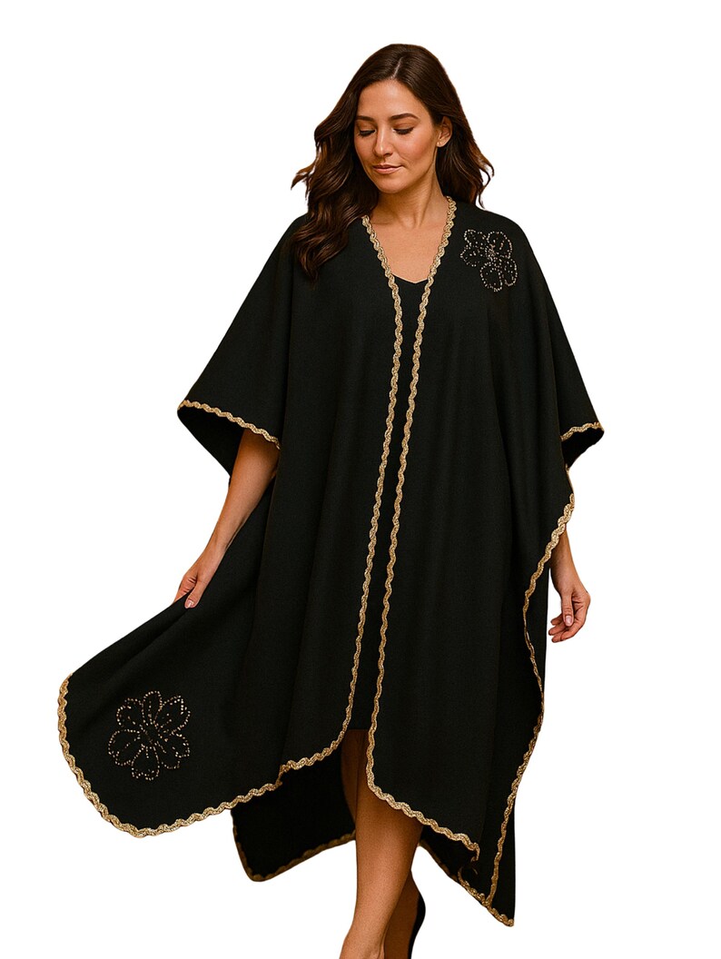 This beautiful linen cape features hand embroidery gold trim  and flowers, with side slits which under arm snap closure  to create optional wide elbow sleeves.