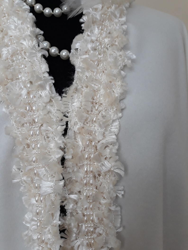 Showcasing of the Ivory Bridal Cashmere Coat, Jacket with Lavish Trim, Couture Evening Cape : Detailed close-up of the handcrafted lavish trim collar with silk yarn and pearls