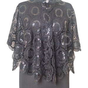 High quality sequinned heavy thick bobbin lace Cape.  Beautiful look with a prom dress. 
it's open front no arm hole, cape style.