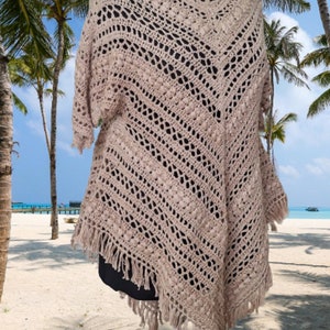 Unique handmade crochet poncho dress in breathable cotton, styled for festivals, beach days, and boho chic outfits.